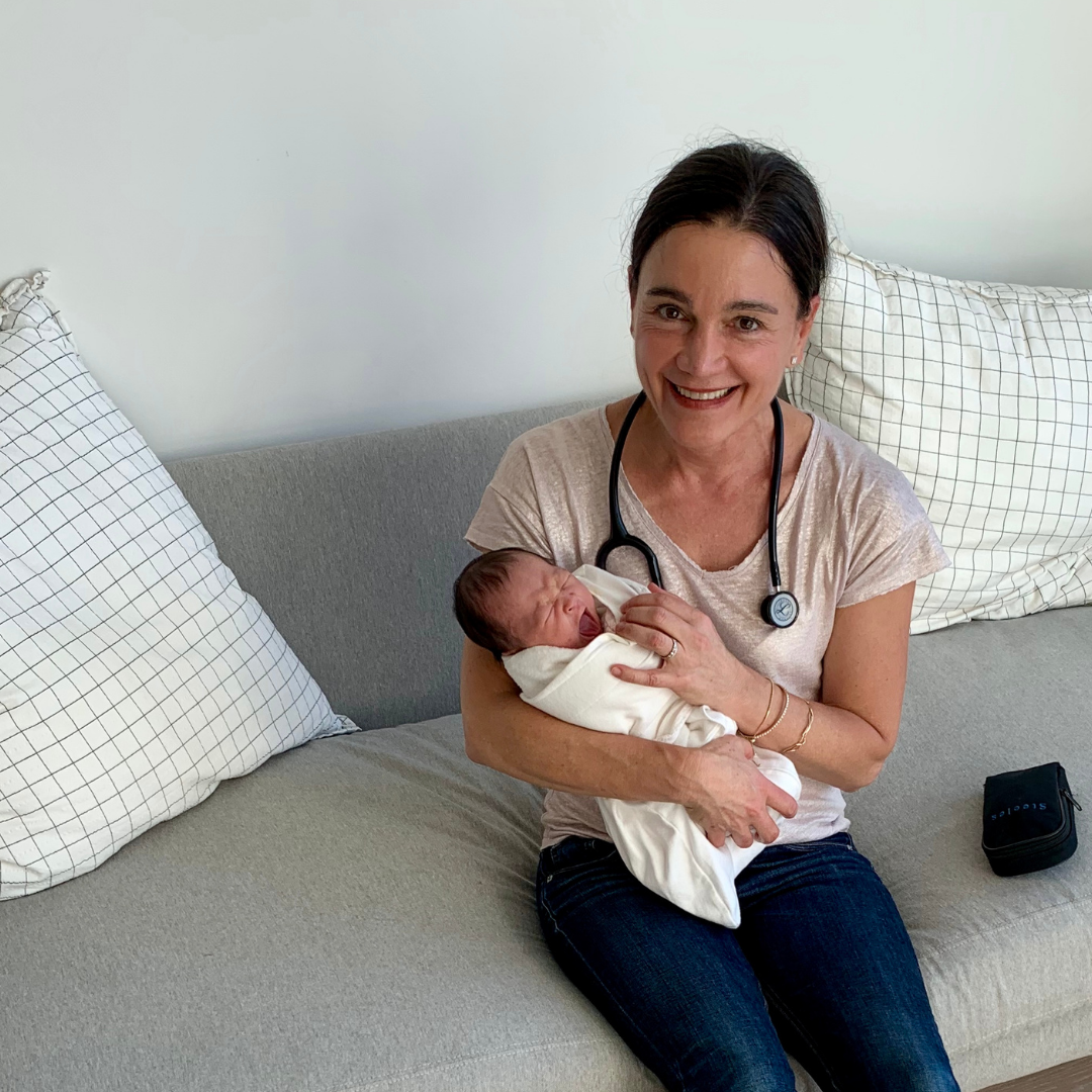 Image of holistic pediatrician Dr. Julia Getzelman with newborn on newborn house call in San Francisco. 