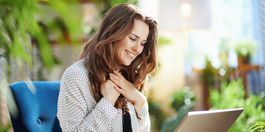 Image of happy woman in online therapy appointment