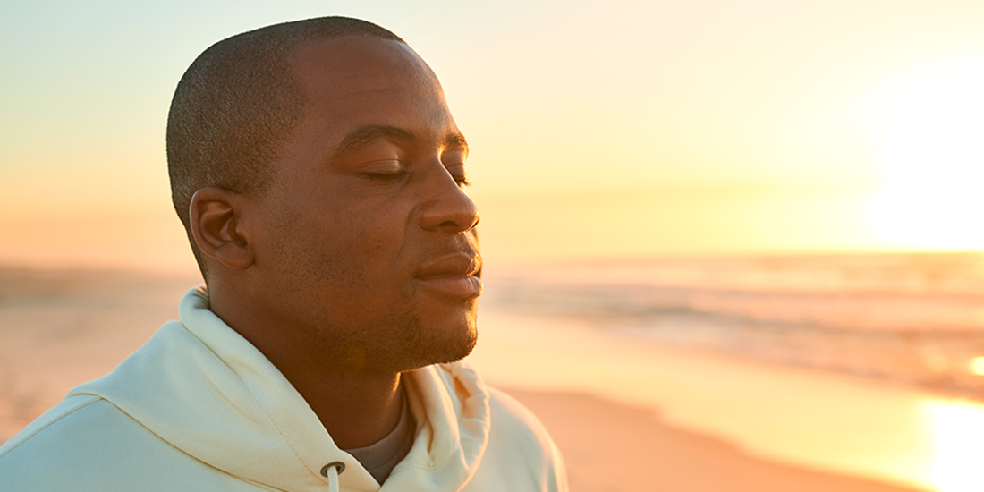 Therapist near me/therapy near me in Mission Viejo, California article main image showing a young man with his eyes closed appearing peaceful with a sunny beach in the background. Celebrating Life Community Health Center has therapists near you in multiple locations in Orange County California, including Mission Viejo, Costa Mesa and Santa Ana, California.